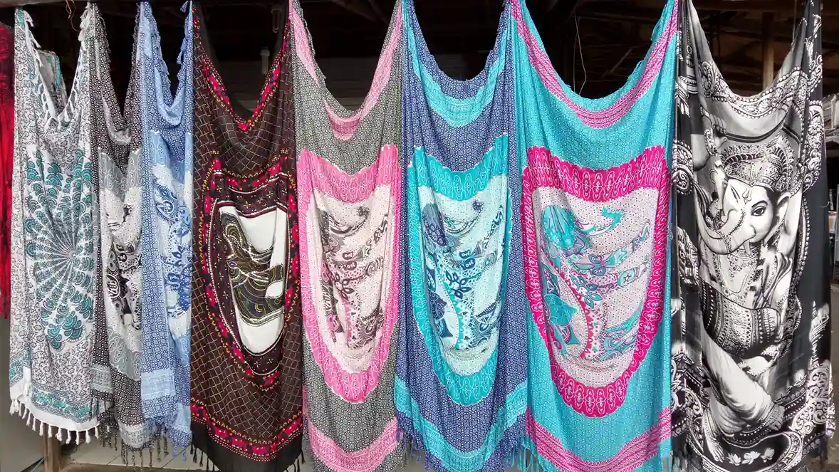 Racks of printed shirts in a Bali shop