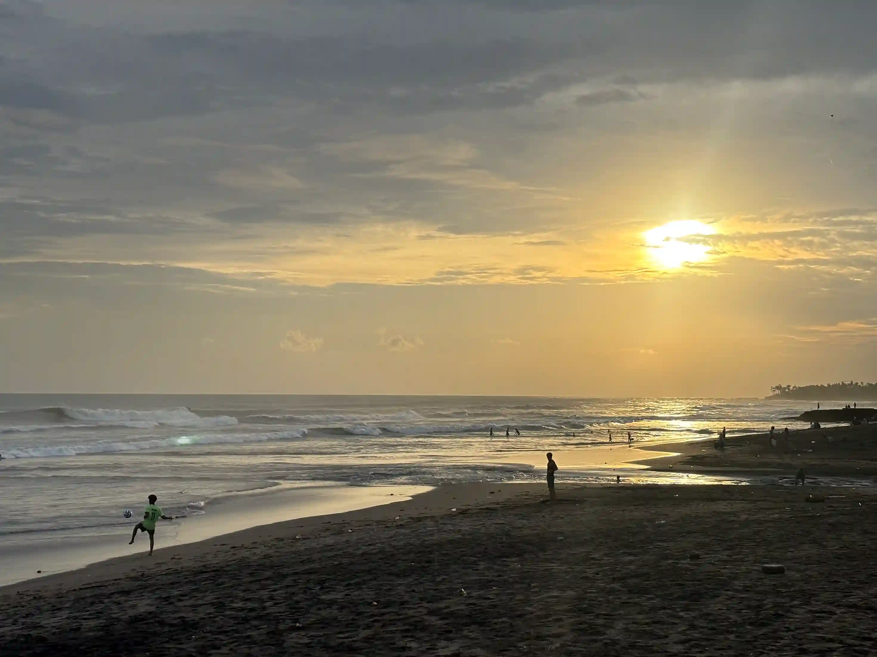 Empty beach at sunset with a low sun